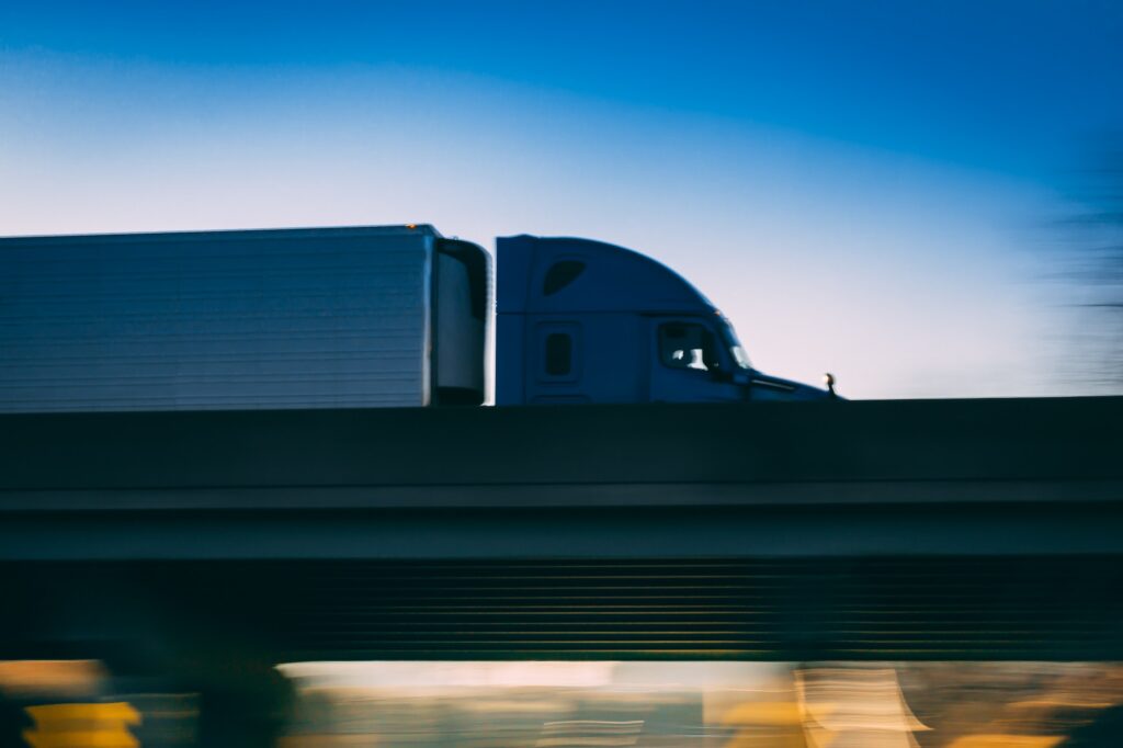 18 wheeler semi truck on highway with motion blur